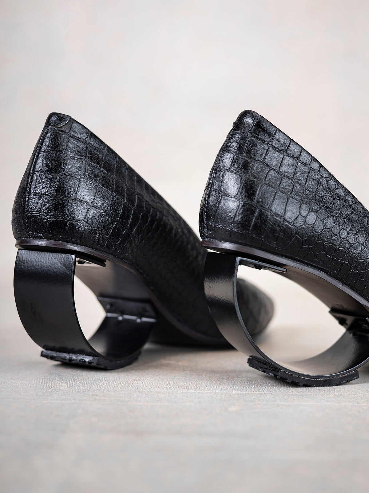 Embossed Black Plant Leather & Steel Crescent Heel Pumps