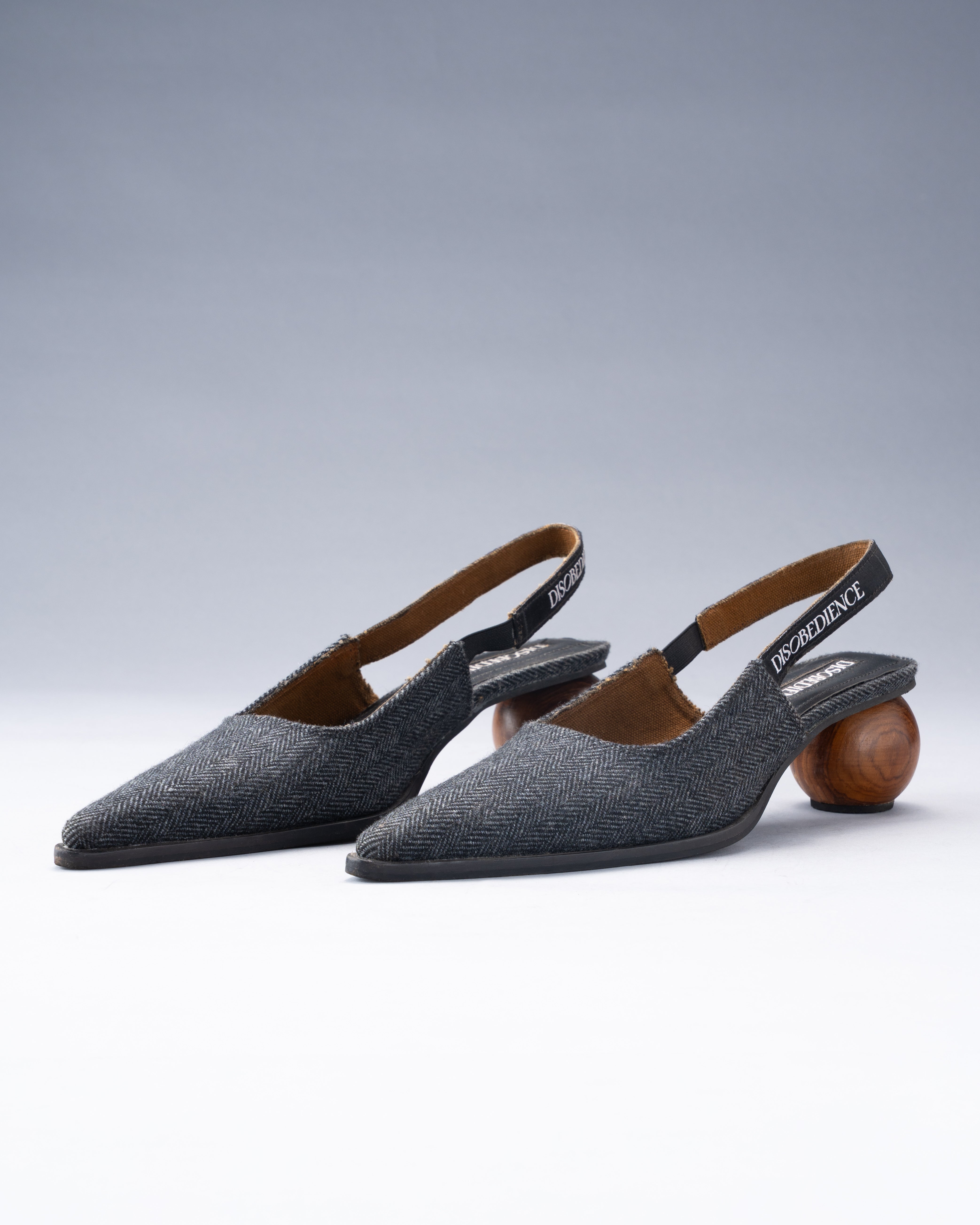 Sling-Back Sandal Balanced on a Spherical Teak Heel