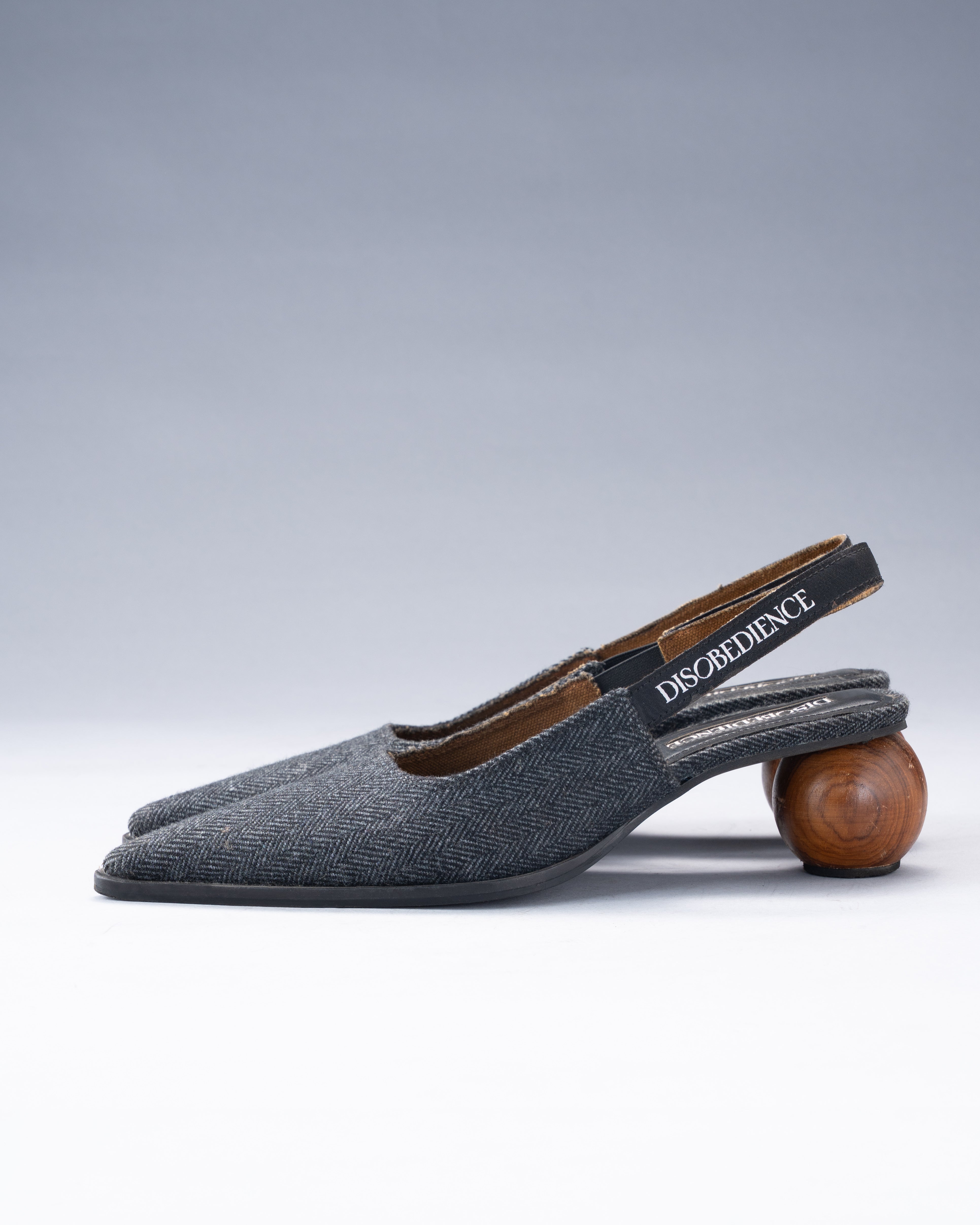 Wool-Blend Shoe Balanced on a Spherical Teak Heel