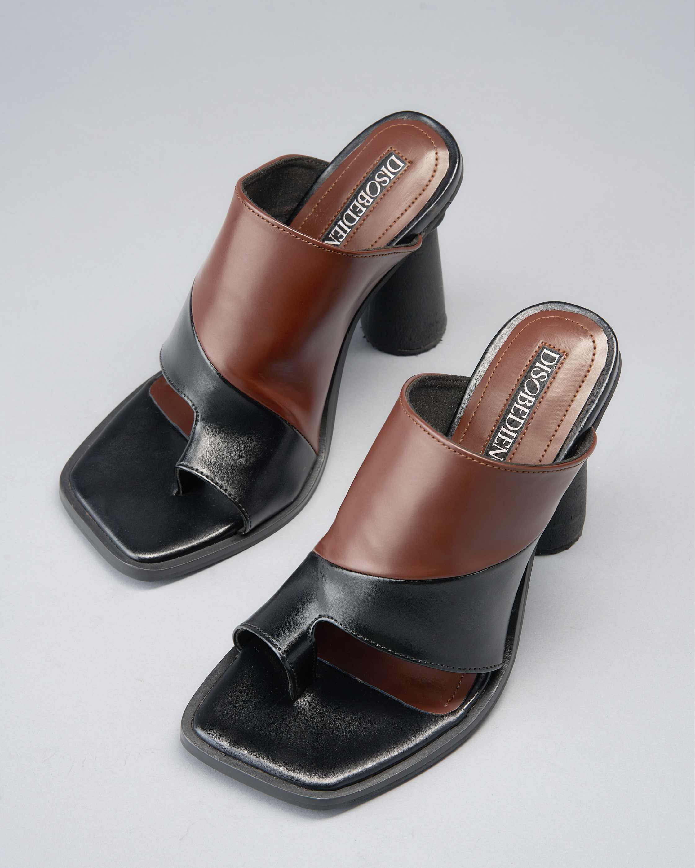 Sculptural, Open-Toe Mule with Graphic Contrast Upper and Architectural Heel.