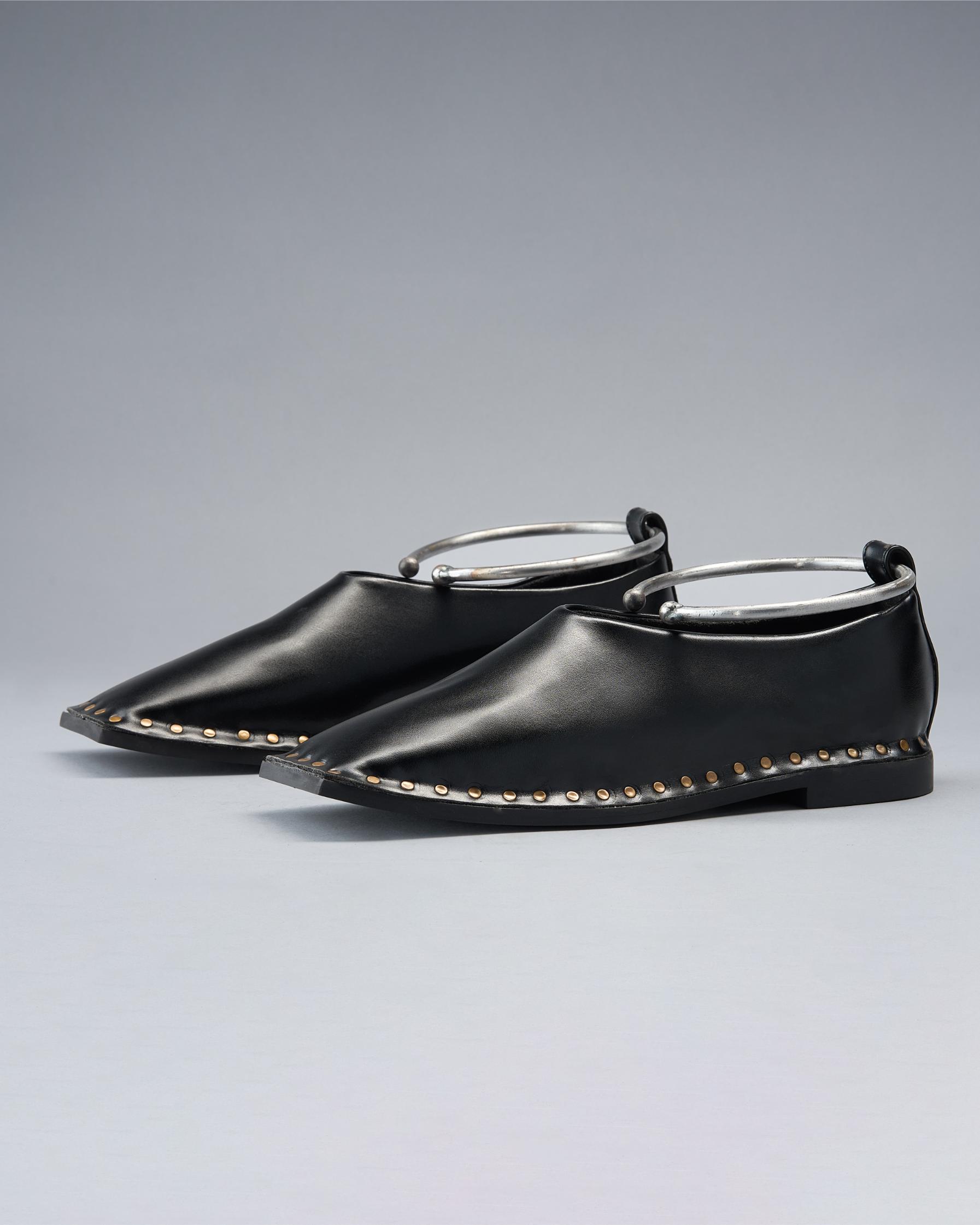 Black Vegan Leather Gladiator Flats Defined by a Circular Ankle Hold