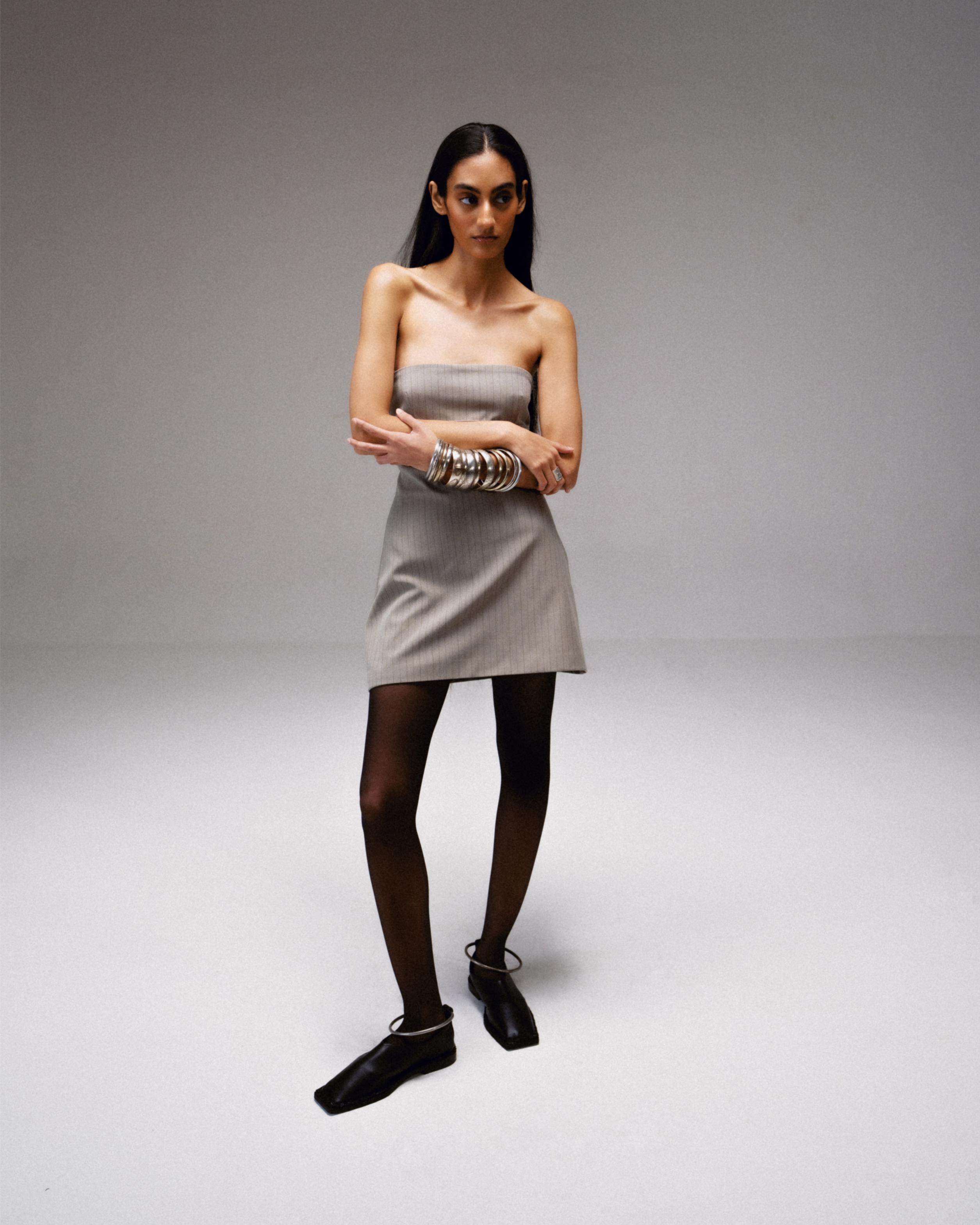 Black Vegan Leather Gladiator Flats Defined by a Circular Ankle Hold