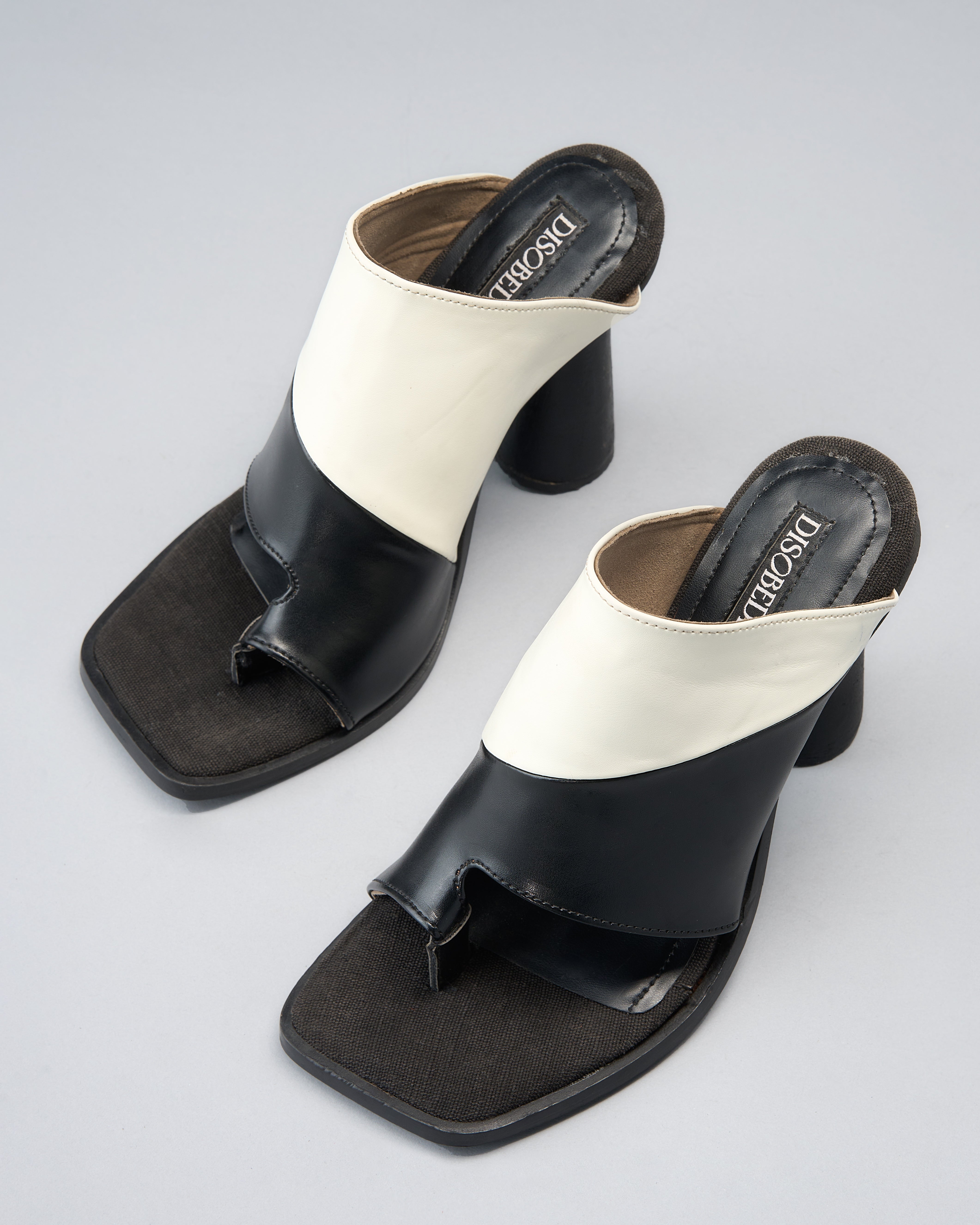 Sculptural, Open-Toe Mule with Graphic Contrast Upper and Architectural Heel.