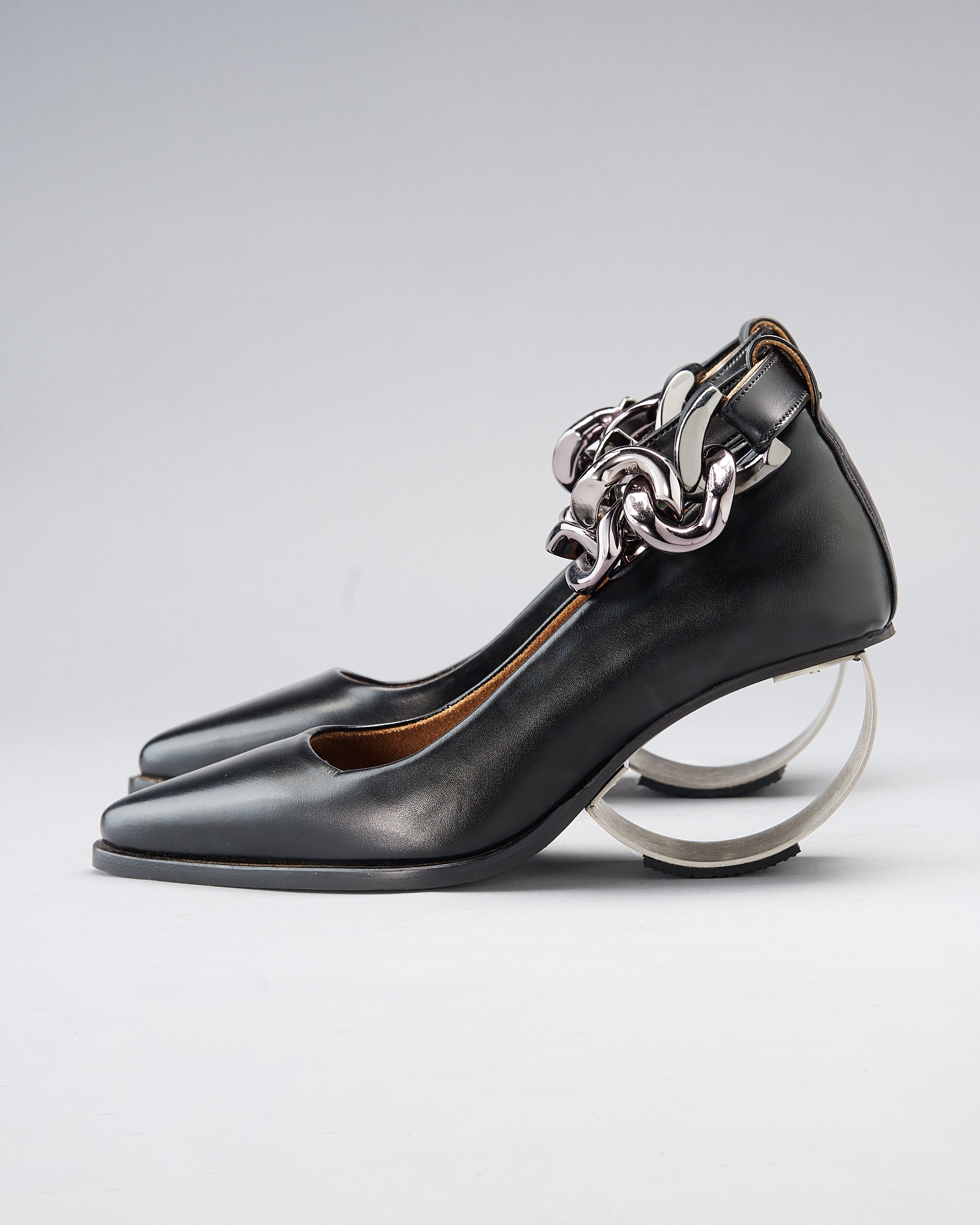 Sculptural Plant Leather Shoe grounded by a Steel Arc Heel and Secured with a Chain