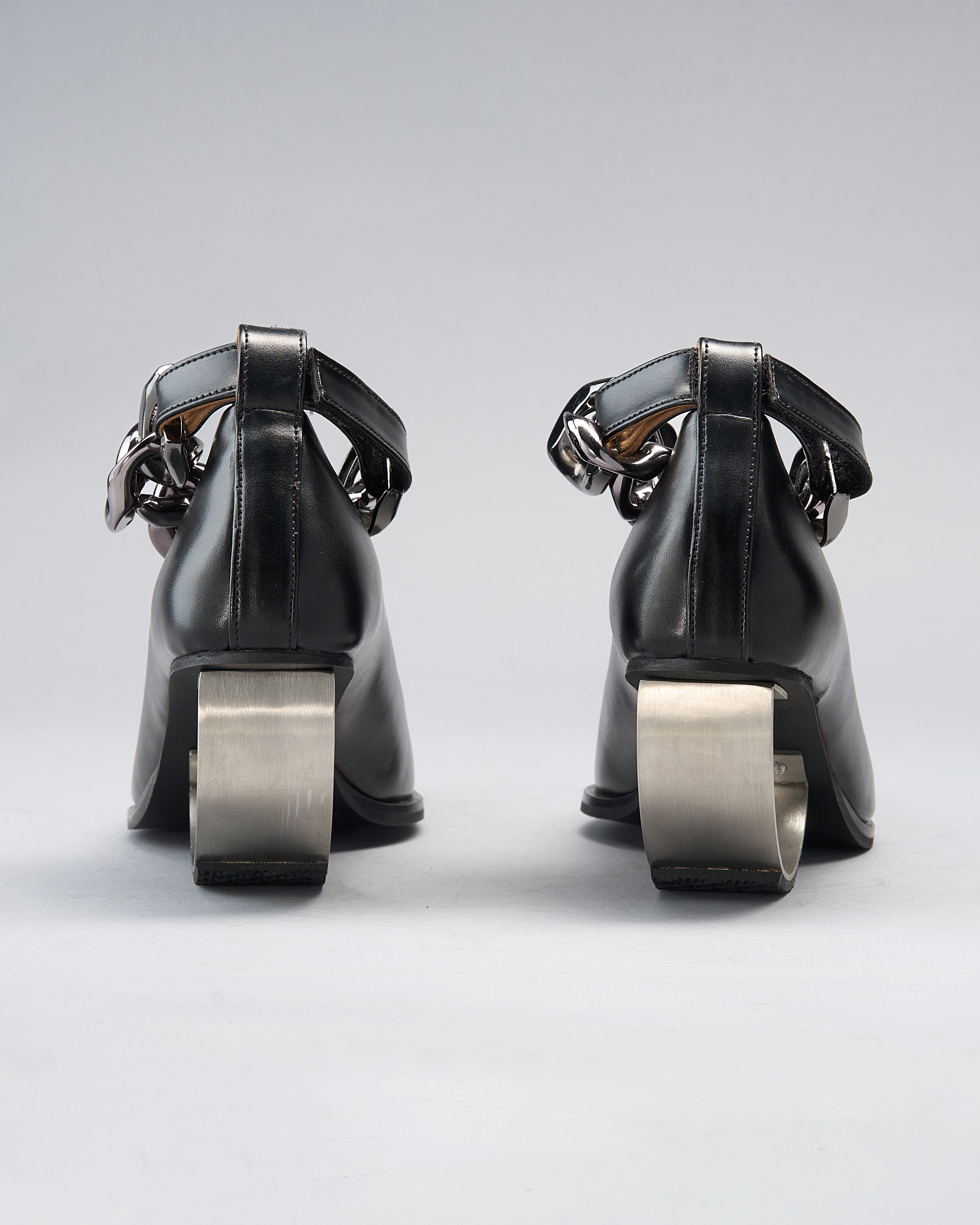 Sculptural Plant Leather Shoe grounded by a Steel Arc Heel and Secured with a Chain