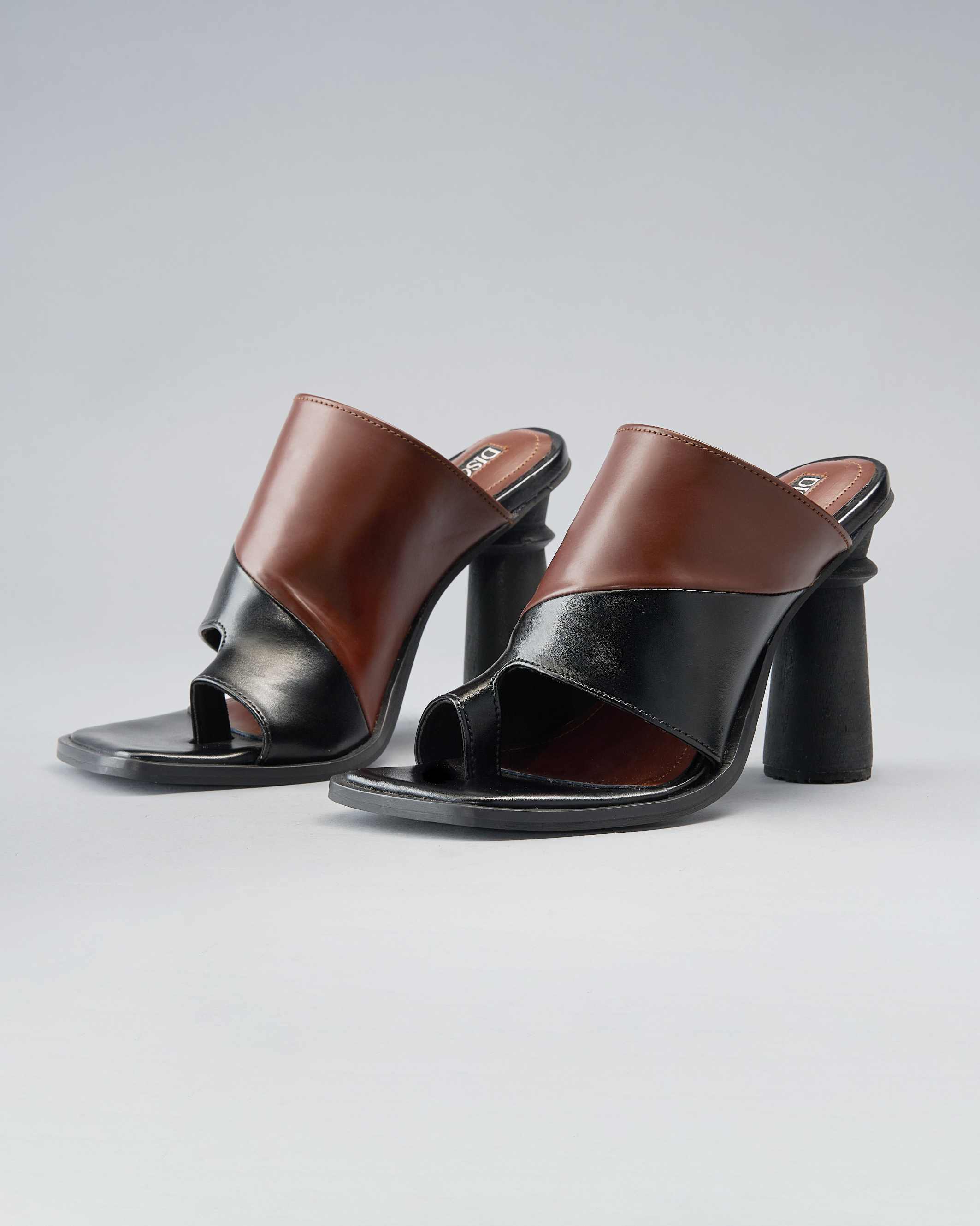 Sculptural, Open-Toe Mule with Graphic Contrast Upper and Architectural Heel.